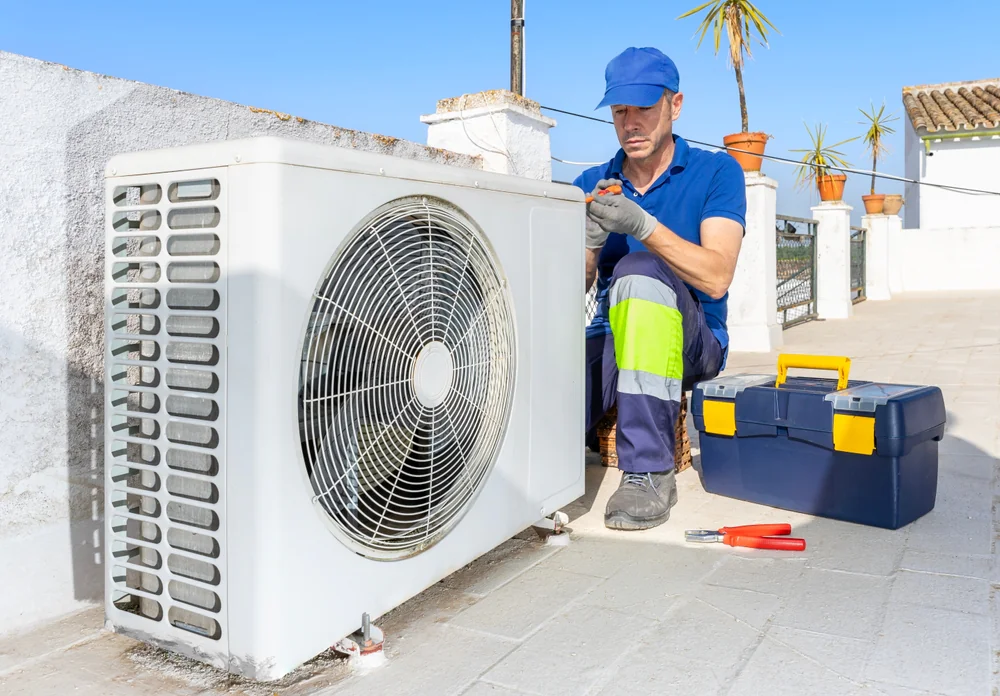 Texas Air Repair technician repairing a heat pump