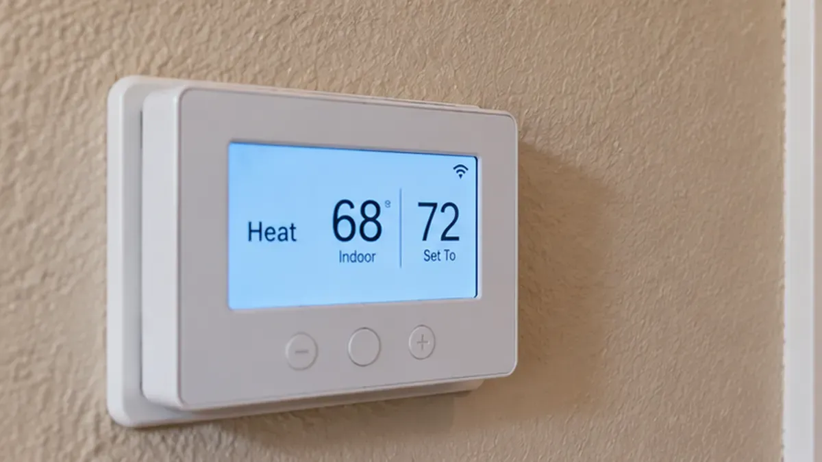 Digital thermostat set to Heat at 72°F while the indoor temperature reads 68°F.